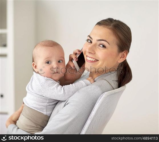 business, motherhood, multi-tasking, family and people concept - happy smiling businesswoman with baby calling on smartphone at office