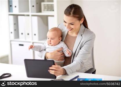 business, motherhood, multi-tasking, family and people concept - happy smiling businesswoman with baby and tablet pc computer working at office. businesswoman with baby and tablet pc at office