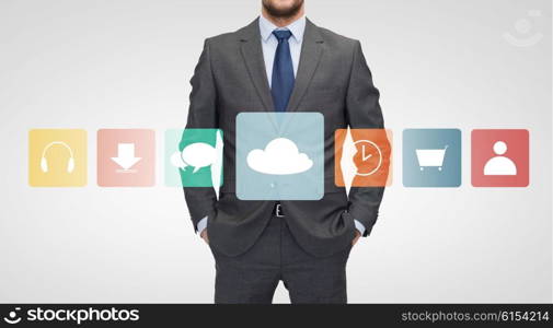 business, multimedia and people concept - close up of businessman in suit with menu icons