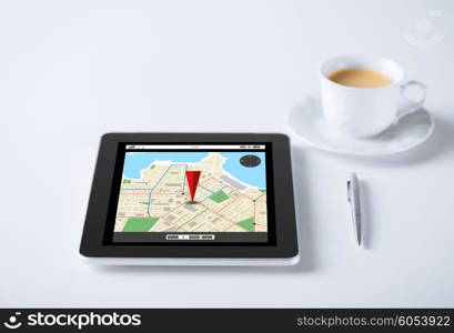 business, navigation, location and technology concept - tablet pc computer with gps navigator map and cup of coffee