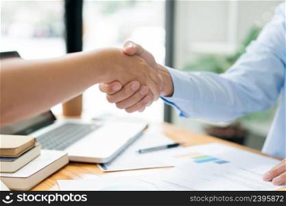 Business negotiation concept the estate representatives shaking hand each other to agree with the deal of land.