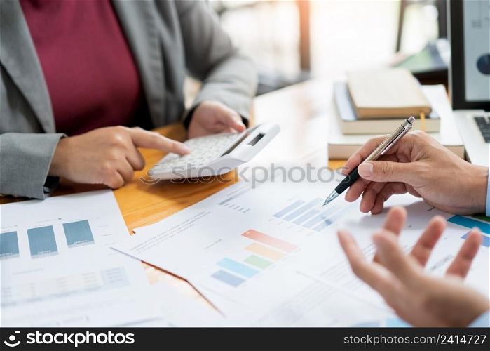 Business negotiation concept the female broker estimating the number of estate and checking it with the male broker.