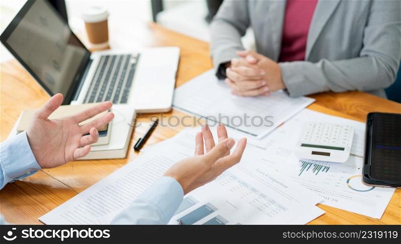 Business negotiation concept the male real estate broker negotiating his point to the female realtor.