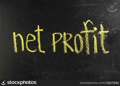 business NET PROFIT written on blackboard