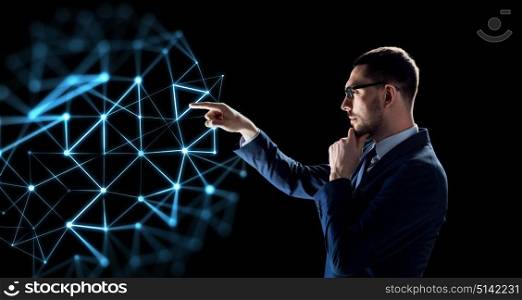 business, network and people concept - businessman in suit with virtual low poly projection over black background. businessman with low poly projection