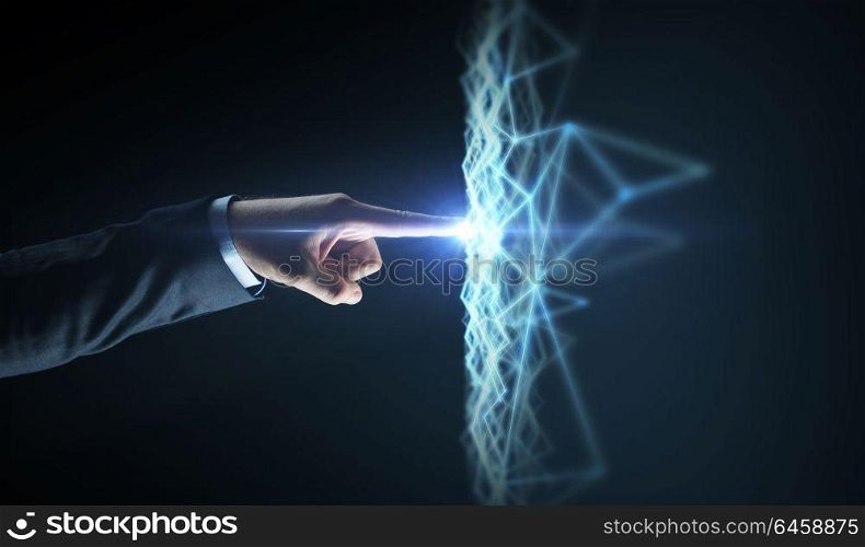 business, network and technology concept - close up of businessman hand pointing finger to virtual low poly hologram over black background. businessman hand connecting to virtual network