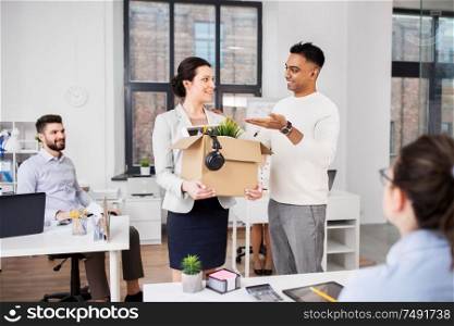 business, new job and corporate concept - male manager introducing happy female employee to colleagues at office. new female employee with colleagues at office