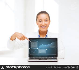 business, new technology and internet concept - smiling woman with laptop computer