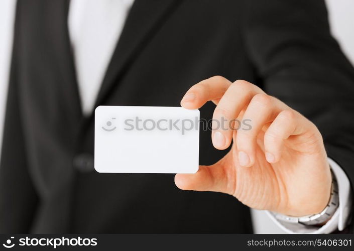 business, office, advertisement concept - businessman showing blank card