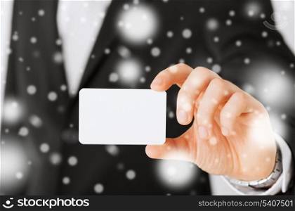 business, office, advertisement concept - businessman showing blank card