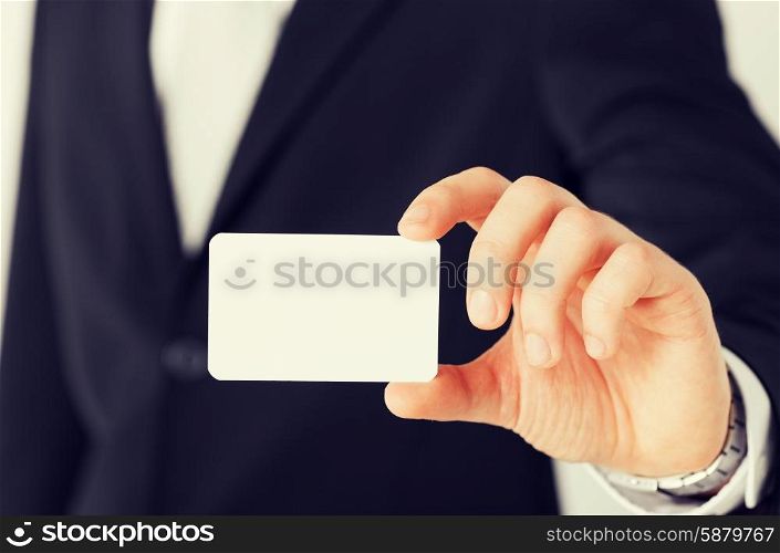 business, office, advertisement concept - businessman showing blank card