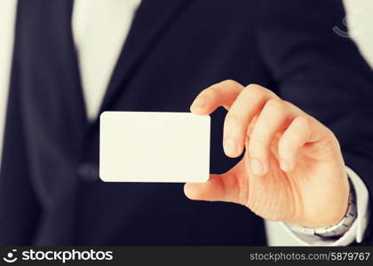 business, office, advertisement concept - businessman showing blank card