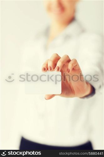 business, office, advertisement concept - businesswoman showing blank card