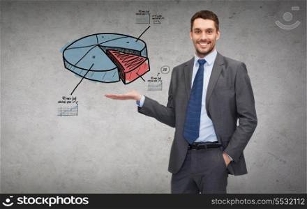 business, office, advertising and people concept - friendly young buisnessman showing growing chart on the palm of his hand