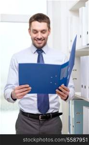 business, office and archive concept - smiling businessman with folder office