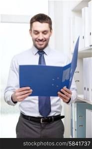 business, office and archive concept - smiling businessman with folder office