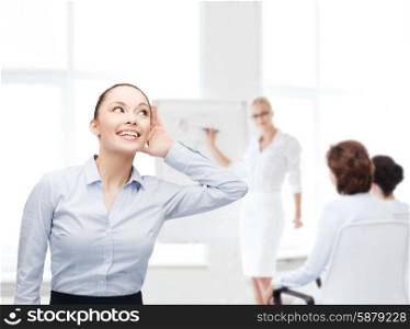 business, office and gossip concept - smiling businesswoman listening gossig at office