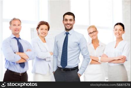 business, office and people concept - group of smiling businessmen in office