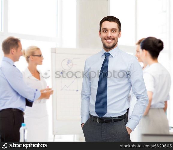 business, office and people concept - group of smiling businessmen with smartboard in office