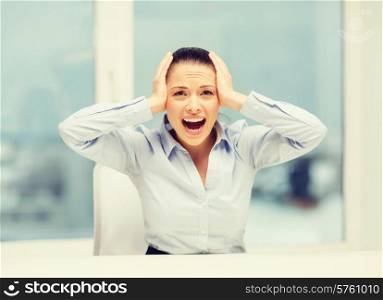 business, office and stress concept - angry screaming businesswoman in office
