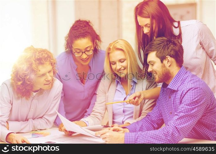 business, office, architecture and startup concept - smiling creative team with color samples and project at office