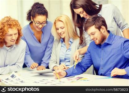 business, office, architecture and startup concept - smiling creative team with color samples at office