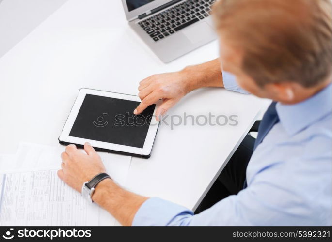 business, office, school and education concept - businessman with tablet pc in office