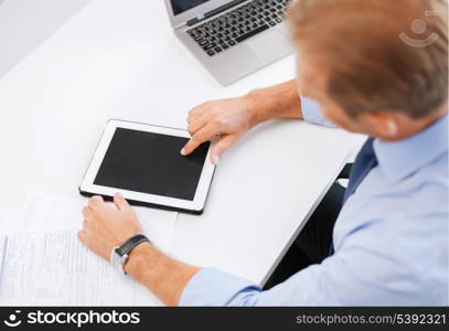 business, office, school and education concept - businessman with tablet pc in office