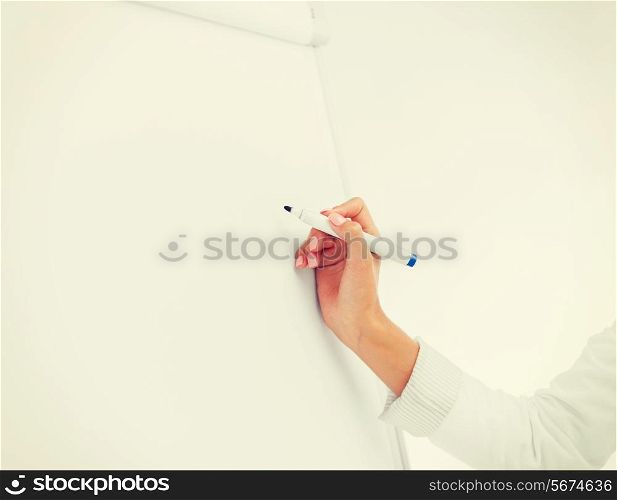 business, office, school and education concept - businesswoman working with flip board in office