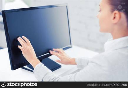 business, office, school and education concept - smiling businesswoman with touchscreen in office. smiling businesswoman with touchscreen in office