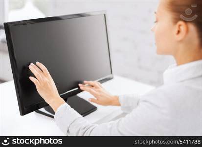 business, office, school and education concept - smiling businesswoman with touchscreen in office
