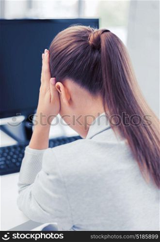 business, office, school and education concept - stressed businesswoman with computer at work. stressed woman with computer