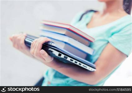 business, office, school and education concept - student with books, computer and folders. student with books, computer and folders