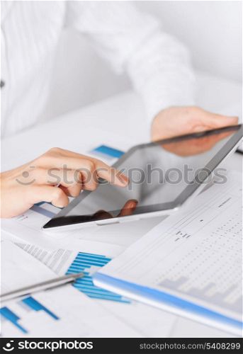 business, office, school and education concept - woman with tablet pc and chart papers