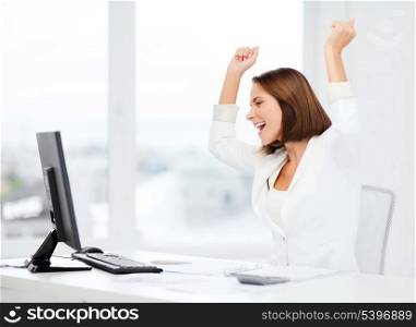 business, office, school, triumph, winning and education concept - happy businesswoman with computer in office