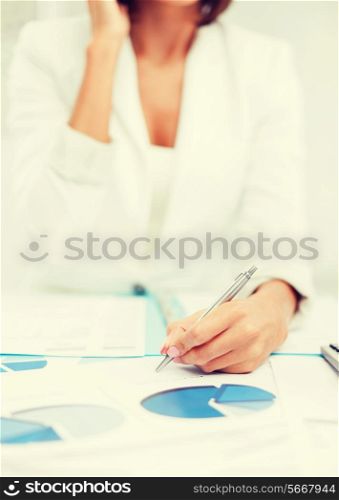 business, office, tax, school and education concept - woman with documents taking phone call