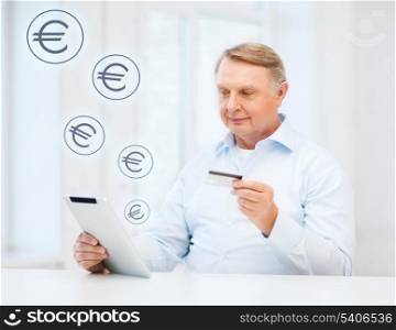 business, oldness, online banking, internet shopping and oldness concept - smiling old man with tablet pc and credit card at home