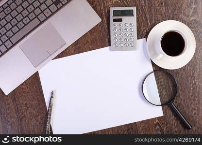 Business papers and a cup of coffee on the table