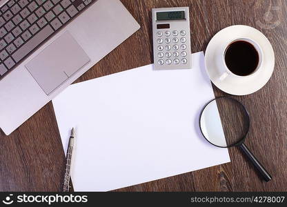 Business papers and a cup of coffee on the table