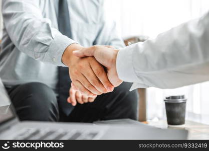 Business partner colleagues shaking hands meeting with new startup project plan Finance and Economy Graph with laptop successful teamwork