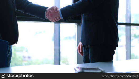 Business Partner Shake Hands on meetinig in modern office building