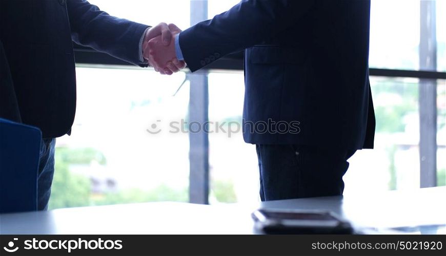 Business Partner Shake Hands on meetinig in modern office building