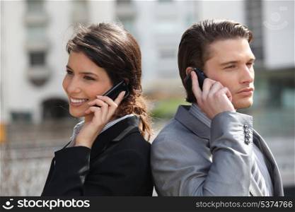 Business partners making calls