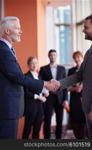 business partners, partnership concept with two businessman handshake