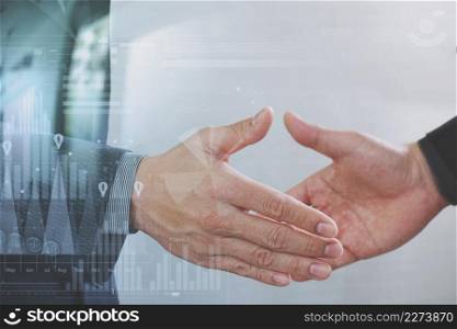 Business partnership meeting concept.photo businessmans handshake. Successful businessmen handshaking after perfect deal.close up,virtual graph chart interface screen