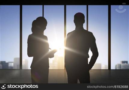 business, partnership, teamwork and people concept - silhouettes of partners over office window background