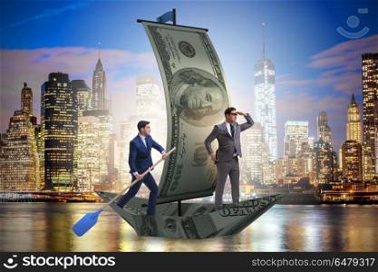 Business partnership with businessmen sailing on dollar boat. Businessman rowing on dollar boat in business financial concept. Business partnership with businessmen sailing on dollar boat