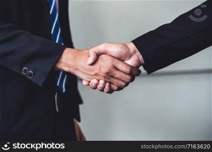 Business people agreement concept. Businessman do handshake with another businessman in the office meeting room.
