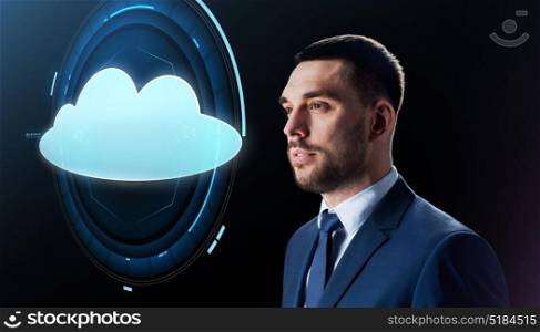 business, people and cloud computing concept - businessman in suit with virtual projection over black background. businessman over black with cloud projection