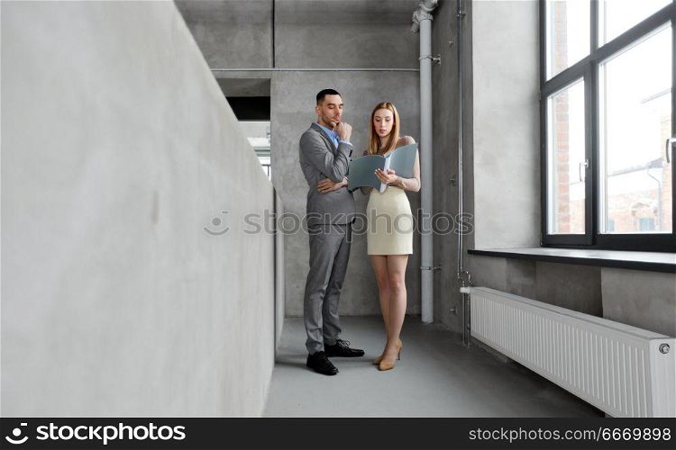 business, people and corporate concept - businesswoman and businessman with folder at office. businesswoman and businessman with folder. businesswoman and businessman with folder